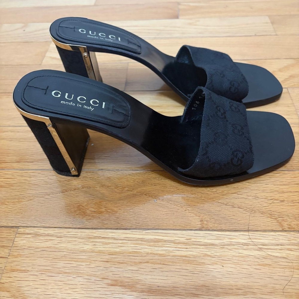 Gucci Black Mules with Gold Accents